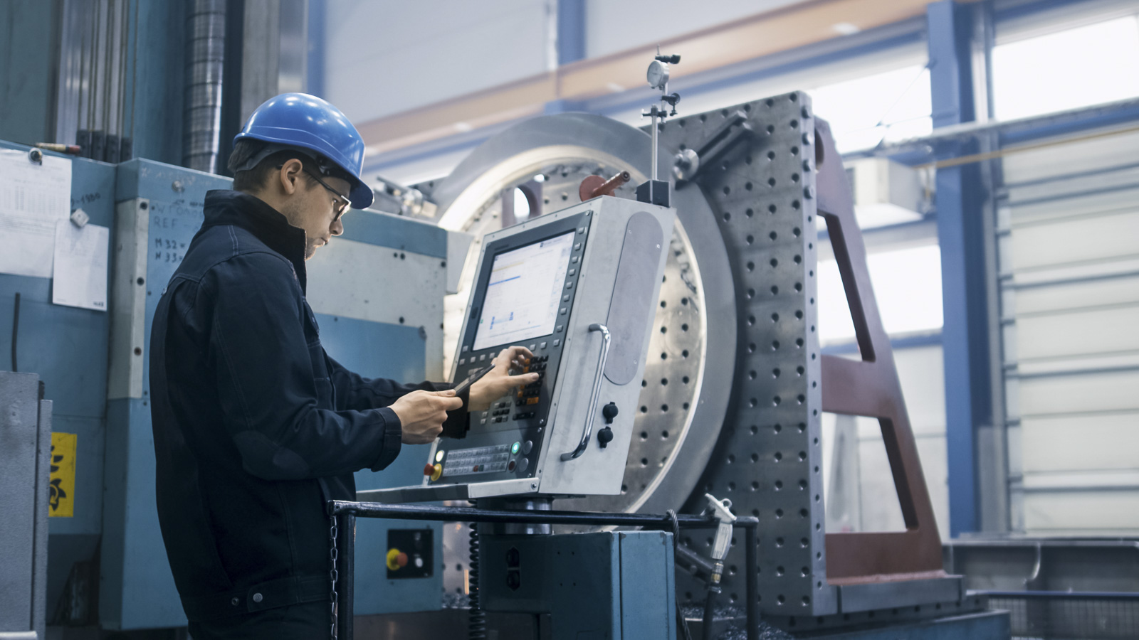 Engineer operating a precision machining center